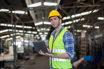 Factory male worker. Engineer man worker working with labtop checking working in industrial manufacturing factory, men at work to checking equipment of machinery production technology or construction.