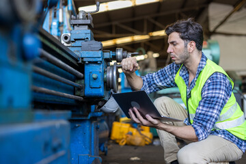 Factory male worker. Engineer man worker working with labtop checking working in industrial manufacturing factory, men at work to checking equipment of machinery production technology or construction.