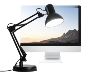 Illuminating the Horizon: A modern desk lamp casts a focused light onto a computer display, where a majestic mountain landscape unfolds, a fusion of technology and nature.