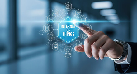 Internet of Things Concept: Hand Touching IOT Interface with Smart Home, Car, Devices, and Cloud Computing Icons. Future Technology Vision.