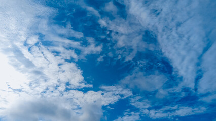 The diverse cirrocumulus clouds create a dynamic and interesting texture.