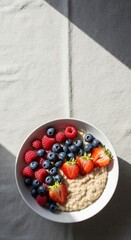 Top-Down Bright Flatlay of Oatmeal Bowl with Berries