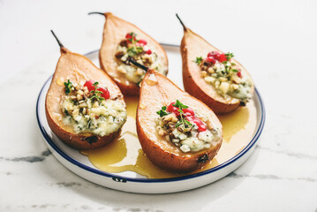Delicious baked pears with nuts, blue cheese, thyme, cranberry and honey