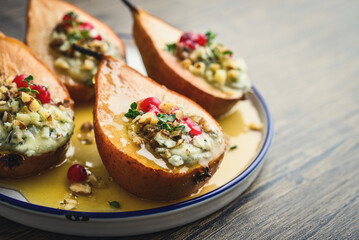 Delicious baked pears with nuts, blue cheese, thyme, cranberry and honey