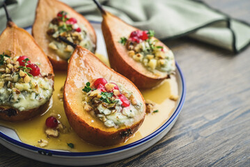 Delicious baked pears with nuts, blue cheese, thyme, cranberry and honey