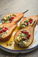 Delicious baked pears with nuts, blue cheese, thyme, cranberry and honey
