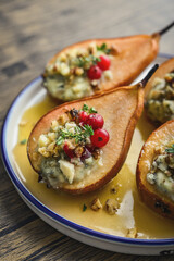 Delicious baked pears with nuts, blue cheese, thyme, cranberry and honey