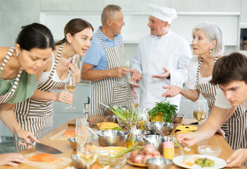 Healthy Food Master Class. Cooking Course. Chef apprentices learn how to cook delicious salmon...