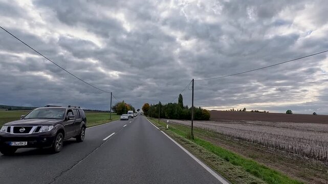 Dresden Germany rural farms road traffic POV. Driving point of view. Industrial center of East Germany, now unified German, European Union (EU) and NATO. Total destruction in WW II and now rebuilt.