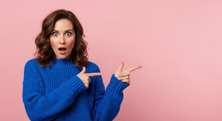 A surprised woman in a blue sweater points excitedly to the side, a perfect image for drawing attention to promotions, announcements, or amazing deals