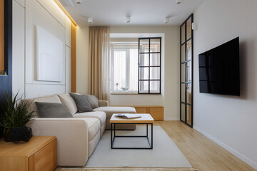 Bright Scandinavian living room showcases a large sofa, coffee table, and sleek modern design aesthetic in the afternoon