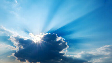 Sunlight shining through dark cloud with blue sky and sun rays in the background creating a serene scene on transparent background
