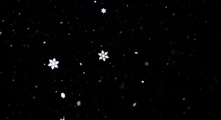 Snow falling from dark night sky. Winter weather background with snowfall and stars