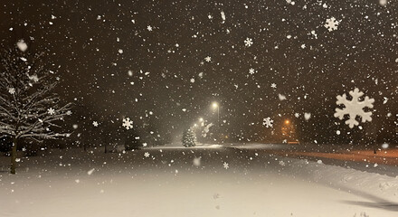 Snow falling from dark night sky. Winter weather background with snowfall and stars