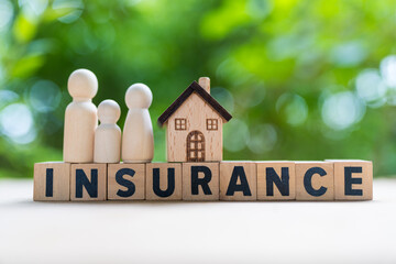 Life, health, property or credit insurance business concept. Insurance is risk control management plan. Wooden block with word of INSURANCE