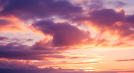 Dramatic sunset sky with vibrant pink and orange clouds over a calm ocean horizon.