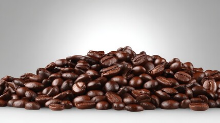 Naklejka premium Rich aromatic roasted coffee beans pile closeup perfect for brewing delicious espresso and morning coffee.