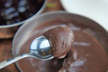 Chocolate dessert preparation with smooth texture in kitchen