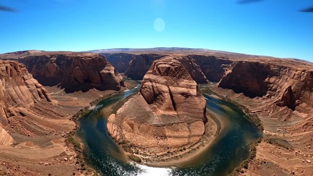 Horseshoe Bend: An awe-inspiring aerial panorama of Horseshoe Bend, where the turquoise Colorado River carves a dramatic U-shaped channel through the fiery red sandstone landscape.