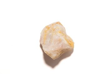 Untreated raw mineral specimen of pale pink and yellow rose quartz crystal, isolated on a white background. Represents geology, healing, spirituality, and natural beauty.