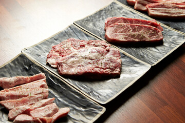 Raw meat from various parts on a plate