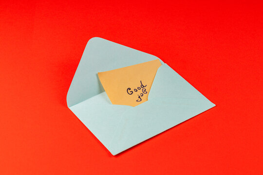 Colorful envelope with a message of encouragement on a red background