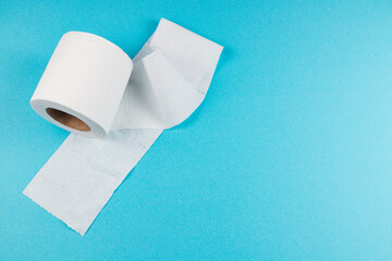 Roll of white toilet paper on a blue background