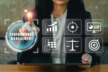 Businesswoman interacting with digital performance management tools, optimizing business strategies and growth.