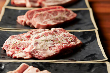 Raw meat from various parts on a plate