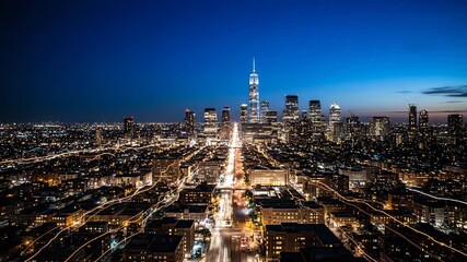 City Lights at Night: A captivating nightscape of a bustling cityscape, showcasing a network of glowing street lights against a deep blue sky.