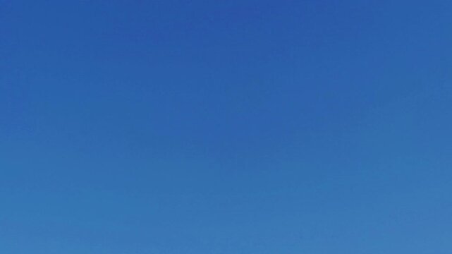 Clear blue sky background with no clouds. A natural, clean and panoramic view of sky on a crystal bright, sunny day &mdash; the perfect blue-sky holiday backdrop
Enjoyed a picnic under the clear blue sky.