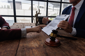 The lawyer explains the contract terms to ensure both parties understand their obligations, noting...