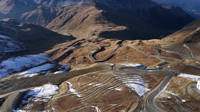 Stelvio pass, Italy, Mountain pass at the swiss italian mountains. Serpentine roads in the alps. Revealing aerial video.