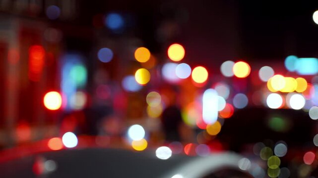 Blurred stabile shot of the fire emergency flashing lights on city street. 