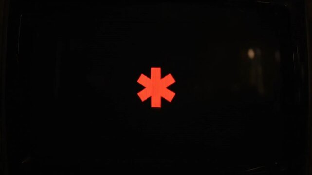 Illuminated Red Star of Life Emergency Medical Symbol.