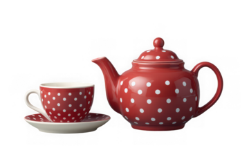 A charming vintage red ceramic teapot with white polka dots next to a matching teacup and saucer isolated on transparent background