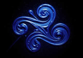 Obraz premium Intricate swirling pattern of deep sapphire blue shimmer liquid on a dark background