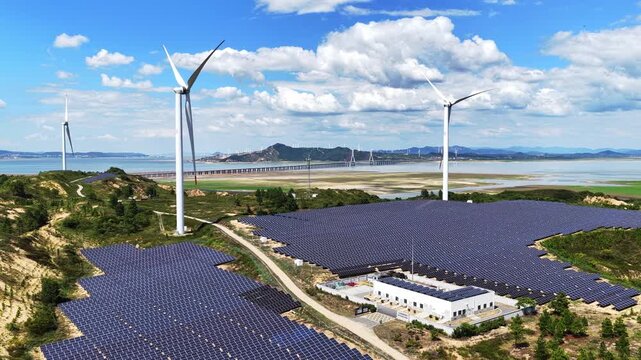 Solar photovoltaic windmills and wind power generation with blue sky and white clouds