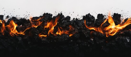 Abstract depiction of fire and scorched earth against white background
