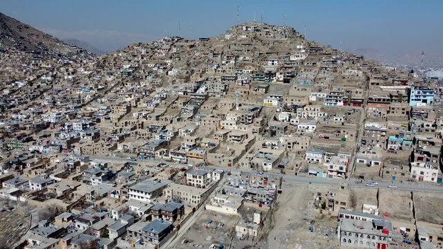 Kabul, Afghanistan. Drone Aerial View of Residential Hillside Neighborhood, Homes in Western Suburbs of Country's Capital