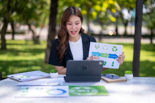 Businesswoman presenting esg sustainability data during video call outdoors