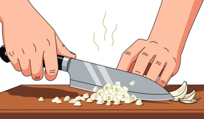 Hands chopping garlic cloves with a kitchen knife on a wooden cutting board, preparing ingredients for cooking.