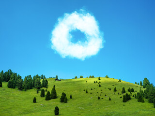 Green fields on hills and blue sky
