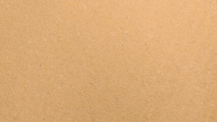 Background of brown kraft paper or cardboard texture. Abstract pattern of beige rough carton, old paper sheet, 