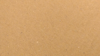 Background of brown kraft paper or cardboard texture. Abstract pattern of beige rough carton, old paper sheet, 