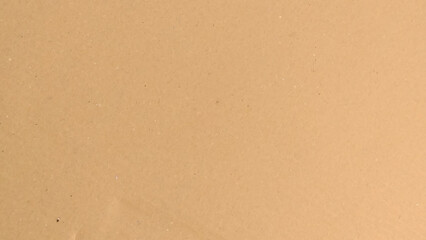Background of brown kraft paper or cardboard texture. Abstract pattern of beige rough carton, old paper sheet, 