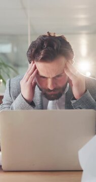 Frustrated, businessman and stress with documents on laptop for overworked or pressure in office. Man, employee or headache with migraine or anxiety for workload, deadline or strain in workplace