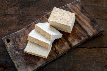 Sliced tofu on the cutting board. 