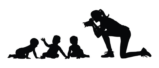 Female photographer taking pictures of babies and toddlers playing together on the floor black silhouette vector illustration.