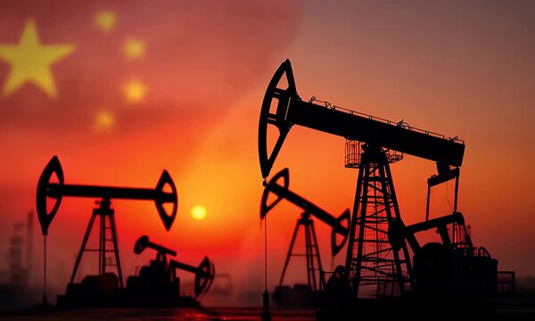 Silhouette of oil pump jacks working against a China flag background Chinese energy industry and economy concept video animation.